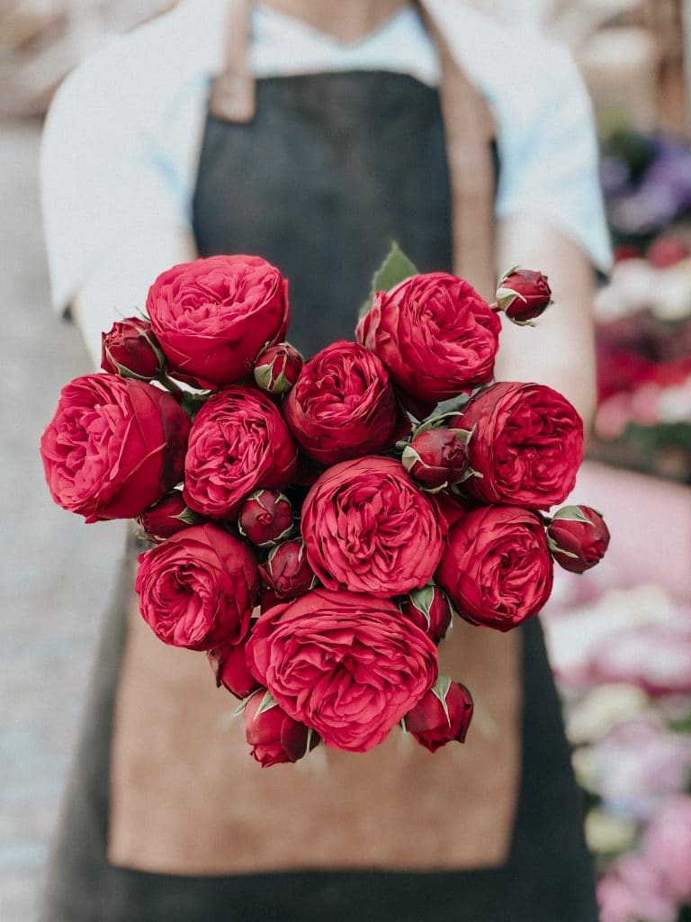 Florist making valentines day flower bouquets